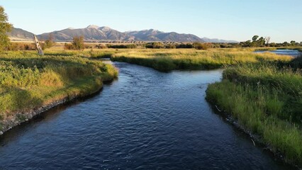 Flyover aerial of the Madison River channel in Ennis, Montana