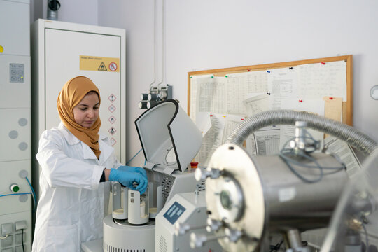 Researcher Wearing Hijab Using Scientific Equipment