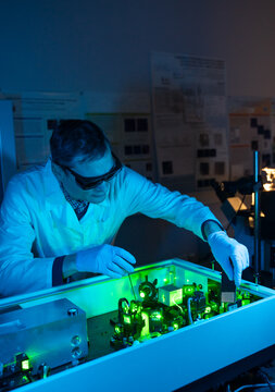 Male Researcher Working With Laser Technologies