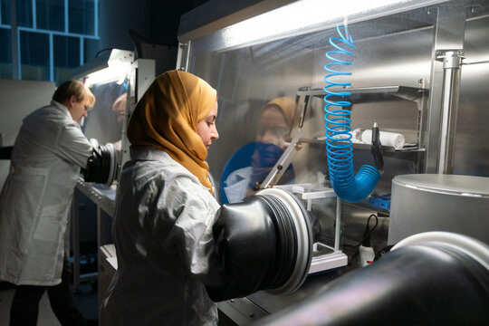 Researchers Using The Glovebox