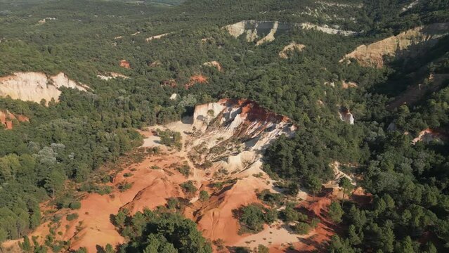 Aerial footage of Red sands and abstract Rustrel canyon moher cliffs landscape. Provencal Colorado near Roussillon,in the Vaucluse department - Southern France.