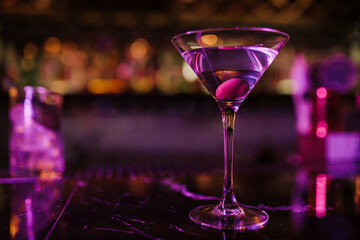 Elegant Martini Glass with Olive on Vibrant Bar Counter