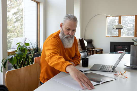 Exploring Pamphlet With Laptop