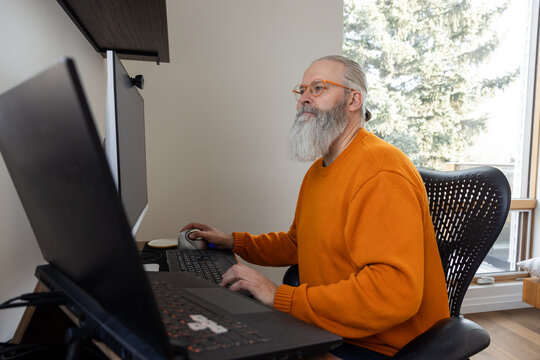 Working On Computer In Home Office