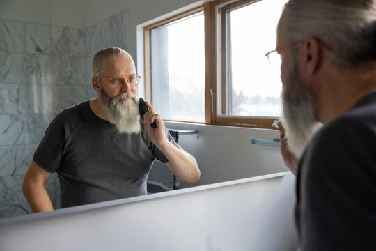 Man Combing Beard