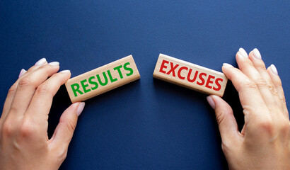 Results or Excuses symbol. Concept word Results or Excuses on wooden blocks. Businessman hand. Beautiful deep blue background. Business and Results or Excuses concept. Copy space - obrazy, fototapety, plakaty
