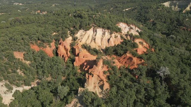 Aerial footage of Red sands and abstract Rustrel canyon moher cliffs landscape. Provencal Colorado near Roussillon,in the Vaucluse department - Southern France.