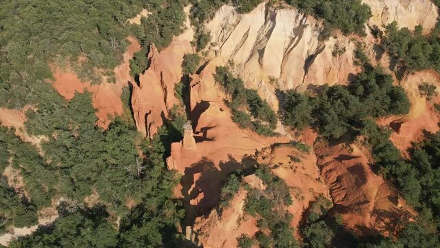 Aerial footage of Red sands and abstract Rustrel canyon moher cliffs landscape. Provencal Colorado near Roussillon,in the Vaucluse department - Southern France.