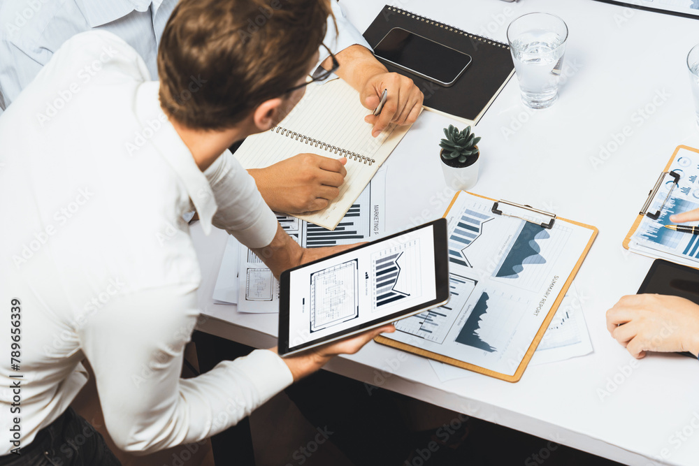 Fototapete analyst team uses bi fintech display tablet to analyze financial data . business people analyze bi s