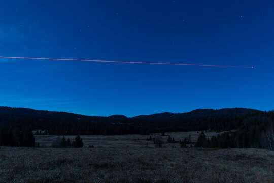 Weird landscape with red line star sky