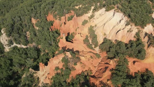 Aerial footage of Red sands and abstract Rustrel canyon moher cliffs landscape. Provencal Colorado near Roussillon,in the Vaucluse department - Southern France.