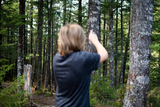 knife throwing in the woods