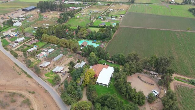 Aerial View of Rural Landscape with Crop Fields, Swimming Pool, and Farmhouses