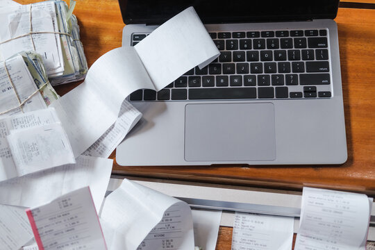 messy receipts and a  laptop