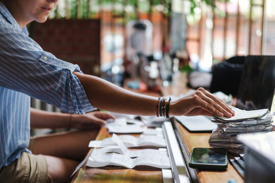 woman organizing recepits at her small business