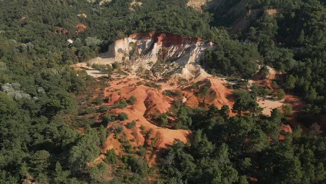 Aerial footage of Red sands and abstract Rustrel canyon moher cliffs landscape. Provencal Colorado near Roussillon,in the Vaucluse department - Southern France.