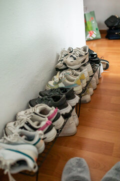 ugc of slippers in a bedroom shoe rack