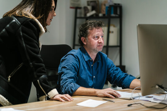 Photographer editing photos on computer