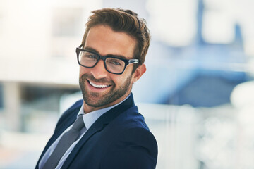 Smile, thinking and businessman with glasses in an office for idea, startup and project...