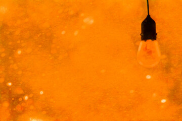 Lightbulb edgy modern lightbulb with snow falling (filtered photo) in Orange white lightbulb, light, epiphany, idea, lightbulb moment, snow, snowfall, falling, snow winter, modern, w/Snow Falling
