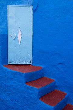 Painted blue and red stairway, Morocco