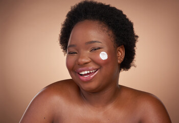 Black woman, portrait and cream in studio for skincare or beauty, treatment and cosmetic product...