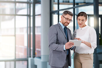 Businessman, staff and office with tablet for meeting by planning, research and ideas from wireless technology. Professional, people and working on computer for teamwork, finance or report on company