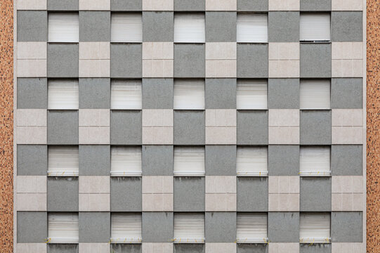 Square windows of a building forming symmetrical patterns