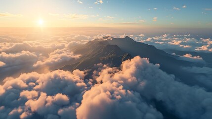 A solitary mountain peak rising from a sea of clouds, standing majestically against a clear blue sky as if touching the heavens. - obrazy, fototapety, plakaty