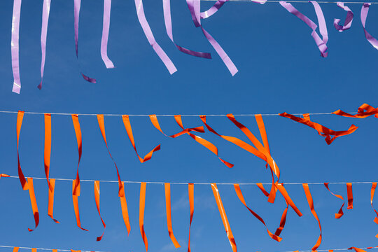 Paper strips hanging with blue sky background