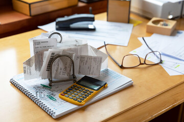 Home office desk with receipts and paperwork 