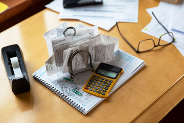 Home office desk with receipts and paperwork 