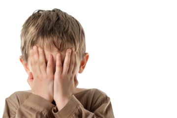 Closeup portrait of an embarrassed kid covering his face with his hands. Transparent background and space for copy