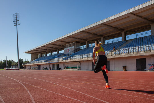 athletic girl training at the stadium
