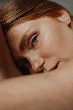 Close Up woman's portrait of Ginger female with many freckles