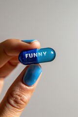 Fingers of a woman holding a blue mini pill to be funny. Medicinal technology