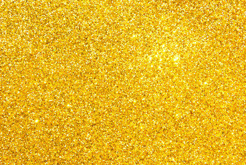 Golden sparkle glitter texture as background
