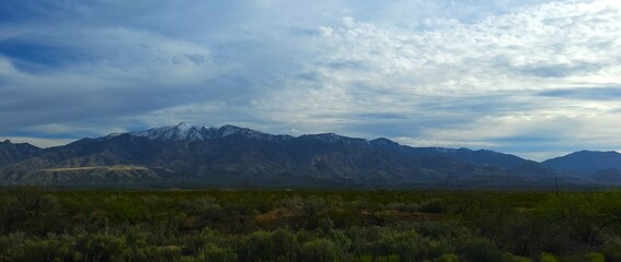 Fototapeta premium Snow tipped Arizona mountains in a rural valley wilderness
