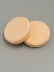 Dissolvable supplement waffer on white surface