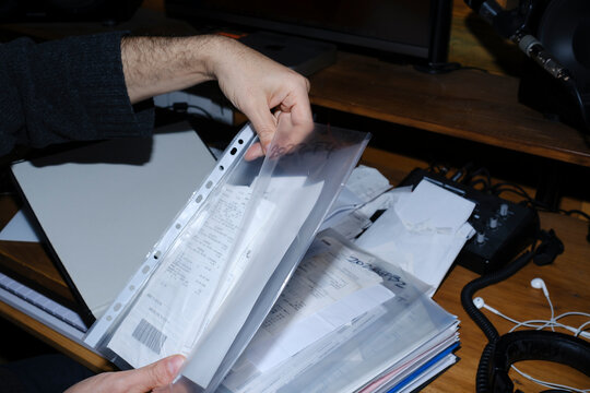 Man organizing receipts for his business accountability