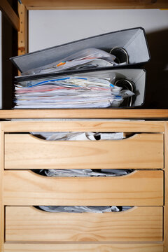 Business receipts in messy cabinet and folder