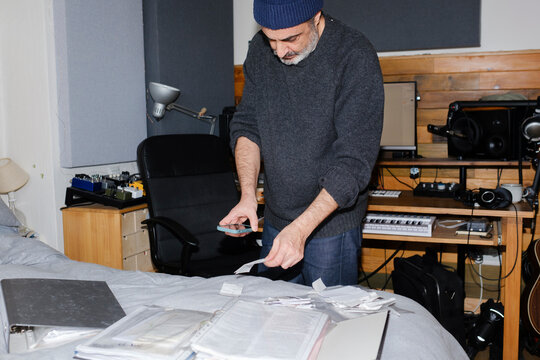 Man organizing receipts for his business accountability