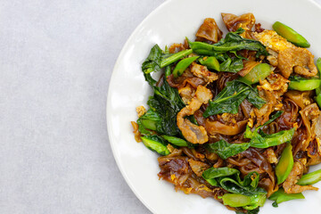 Stir-fried rice noodles with soy sauce and pork