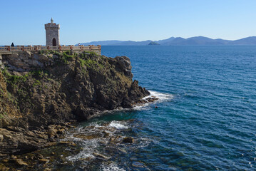 The lighthouse of Piombino, the Rocchetta in Piazza Bovio. View of the Piombino canal and the...