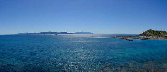 View of the Island of Elba and the marina of Salivoli with Punta Falcone, Piombino, Tuscany, Italy