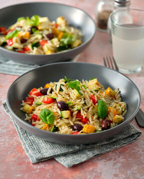 Orzo with basil and veggies.