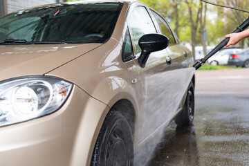 Car wash with high pressure water. Cleaning car with high pressure water.
