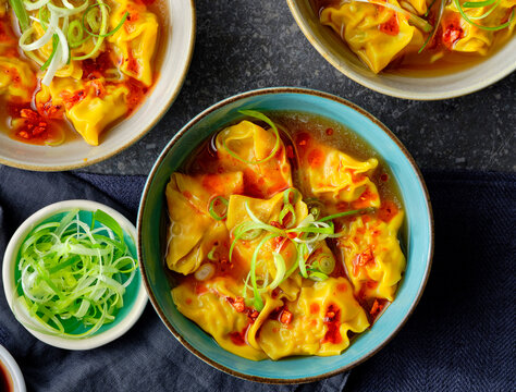 Bowls of wantons in a chicken broth