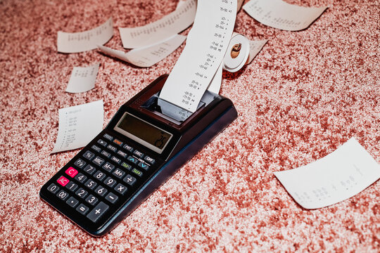 electronic calculator with a paper-roll on the floor