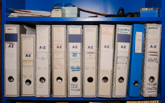 Receipt archive folders in blue shelf